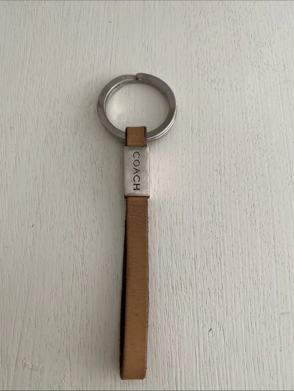 Coach leather strap keychain beige
